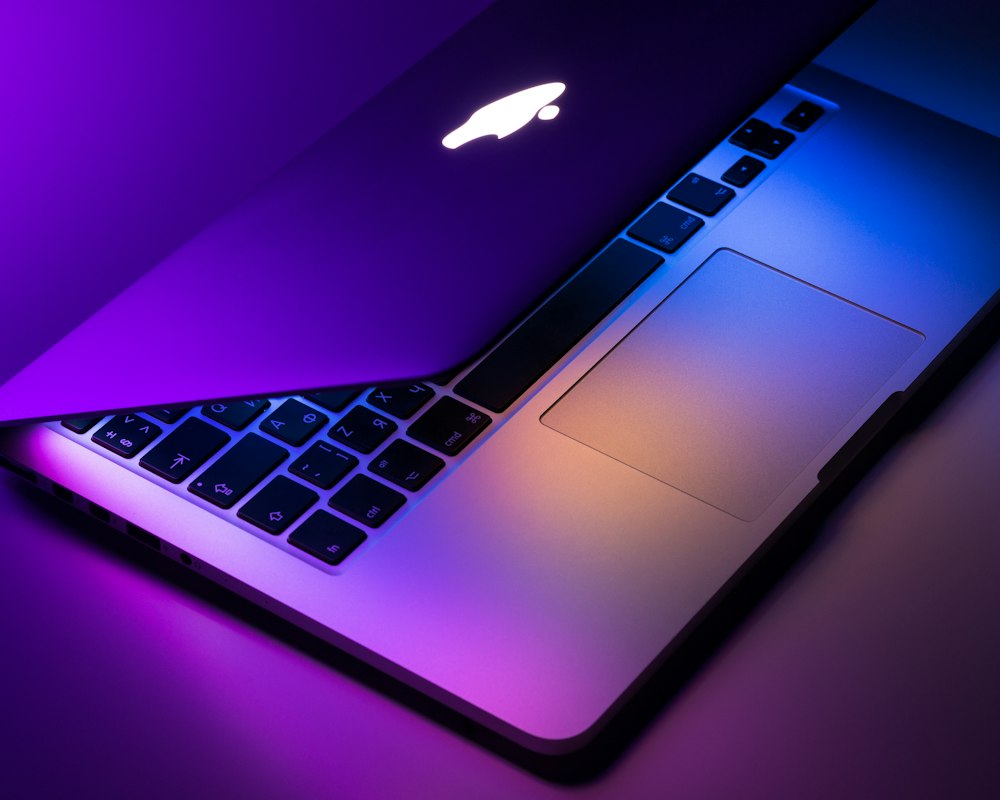 MacBook in purple light